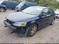 2014 Volkswagen Jetta — photo 2 of 12 | VIN 3VW2K7AJ1EM239612
