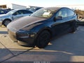 2026 Tesla Model Y — photo 2 of 19 | VIN 7SAYGDEE5TA736464