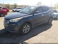 2015 Hyundai Santa Fe — photo 2 of 11 | VIN 5XYZTDLBXFG290253