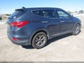 2015 Hyundai Santa Fe — photo 4 of 11 | VIN 5XYZTDLBXFG290253