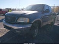 2000 Ford F-150 — photo 2 of 12 | VIN 1FTRX18L8YNC25014