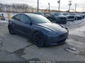 2022 Tesla Model Y — photo 1 of 22 | VIN 7SAYGDEF2NF562190